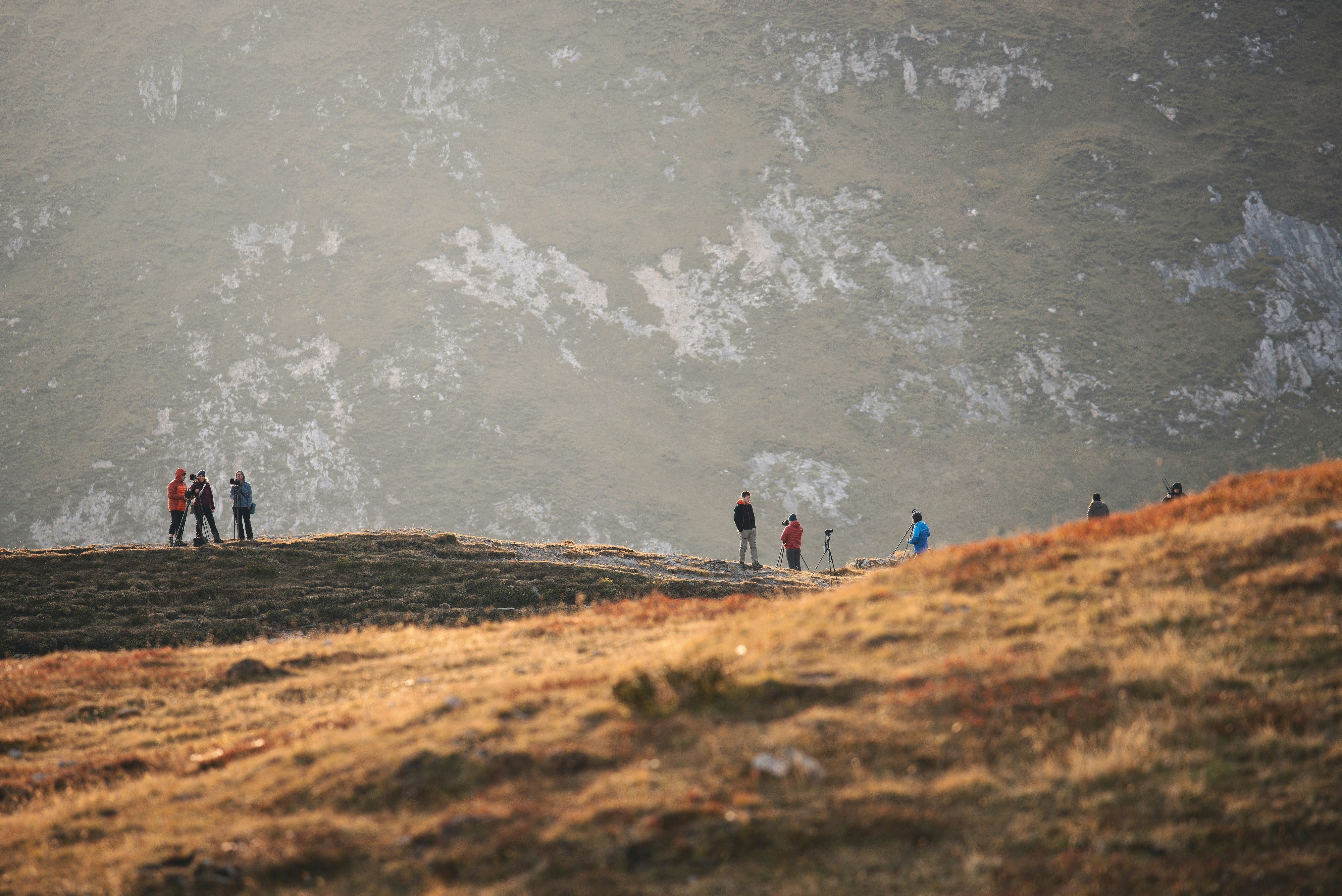 group of people standing on mountain